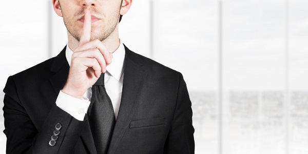 businessman silent quiet gesture